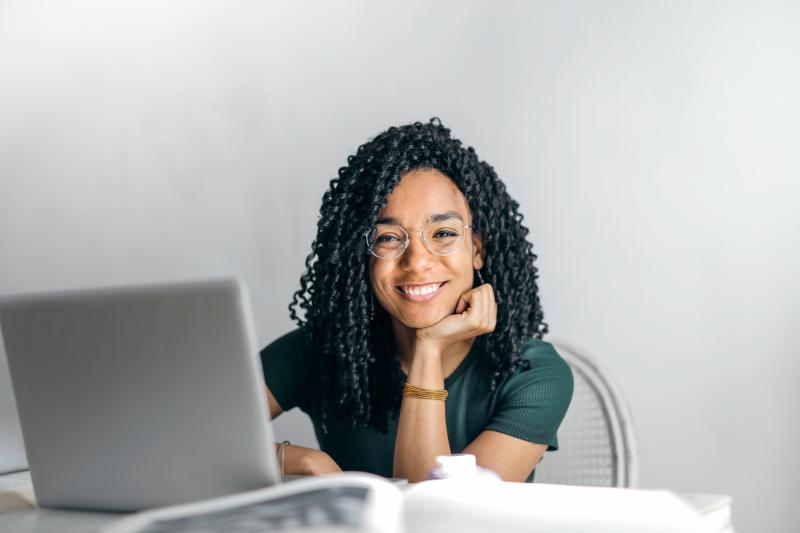 Female at computer smiling