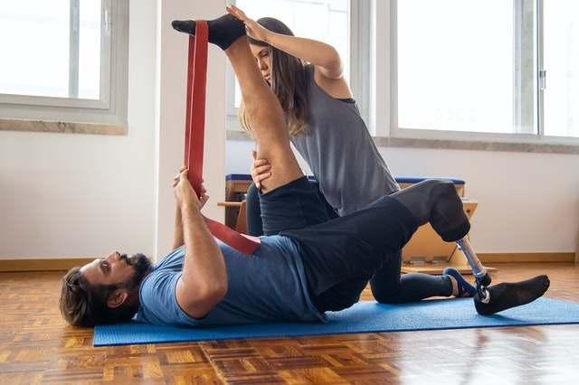 A physiotherapist working with a patient