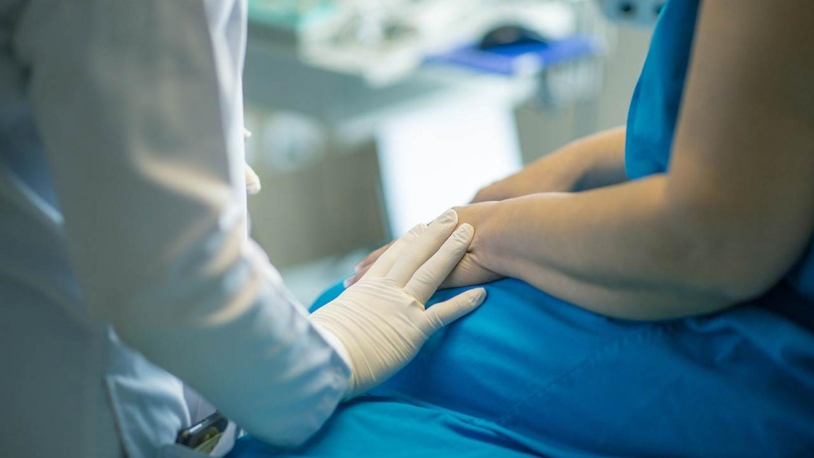 A nurse cares for a patient