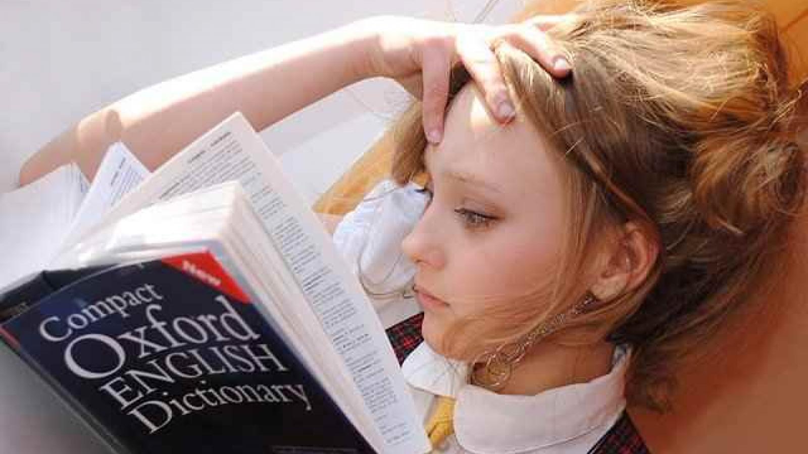 A girl reading an English dictionary